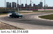 A sports car takes a turn in a skid. Drift racing races. Стоковое видео, видеограф Ярославский Максим / Фотобанк Лори