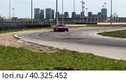 A sports car goes through a turn by swerving. Стоковое видео, видеограф Ярославский Максим / Фотобанк Лори