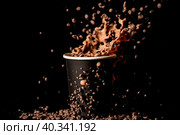Cocoa with milk splashes out of a dark paper cup. Стоковое AI-изображение, AI-художник Ярославский Максим / Фотобанк Лори