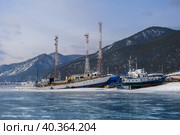 The village of Bolshoe Goloustnoye in winter. Ships on the shore of Lake Baikal. Стоковое фото, фотограф Ирина Толокновская / Фотобанк Лори