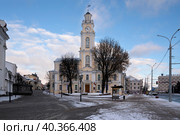 Vitebsk, Belarus, 01.06.2022: View of the historic City Hall building, now the Regional Museum of Local lore is located here, on a winter day. Редакционное фото, фотограф Ula Ulachka / Фотобанк Лори