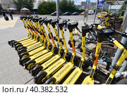 Krasnogorsk, Russia - July 12. 2022 Short-term rental service for electric scooters Yandex Go. Редакционное фото, фотограф Володина Ольга / Фотобанк Лори