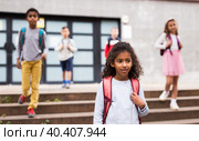 African american preteen girl walking to school on autumn day. Стоковое фото, фотограф Яков Филимонов / Фотобанк Лори
