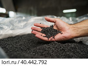 Close up of male hand holding plastic polymer granules. Стоковое фото, фотограф Сергей Толмачёв / Фотобанк Лори