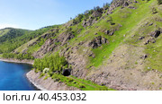 Beautiful summer landscape. High mountains near the shore of Lake Baikal, an old arched tunnel in the rock. Стоковое видео, видеограф Виктория Тельминова / Фотобанк Лори