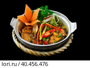 Vietnamese fried Mackerel fish with sauce on black background. Стоковое фото, фотограф Татьяна Терехина / Фотобанк Лори