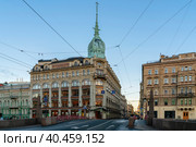 St. Petersburg, Russia, 10.24.2021: View of the building of the store "At the Red Bridge" of the Belgian-Dutch trading company "S.Esders and K.Scheifals" on the Moika River embankment. Редакционное фото, фотограф Ula Ulachka / Фотобанк Лори