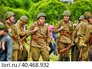 Soldiers in military uniform of the second world war at the historical reconstruction to the Day of the Border Guard. Стоковое фото, фотограф Анна Кривицкая / Фотобанк Лори
