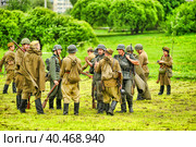 Soldiers in military uniform of the second world war at the historical reconstruction to the Day of the Border Guard. Стоковое фото, фотограф Анна Кривицкая / Фотобанк Лори