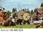 Russia, Staraya Ladoga 23,06,2012 Reenactors with shields and spears during the battle, the festival of historical reconstruction "Pages of History" Стоковое фото, фотограф Анна Кривицкая / Фотобанк Лори