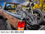 Old motorcycle in the back of an old pickup truck on a forest road. Стоковое фото, фотограф Iva Noel / Фотобанк Лори