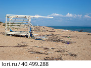 Sandy beach with a lot of garbage on the shore. Ecological catastrophy. Стоковое фото, фотограф Коханова Наталья / Фотобанк Лори