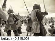 Knights in armor during the battle at the Russian Fortress festival of historical reconstruction (2012 год). Редакционное фото, фотограф Анна Кривицкая / Фотобанк Лори