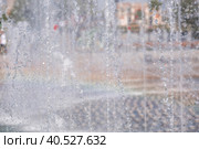 A light and music fountain and a rainbow from the sun on a spring morning. Natural Museum-reserve "Tsaritsyno". Fountain in Tsaritsyno Park. (2023 год). Редакционное фото, фотограф Photojuli / Фотобанк Лори