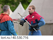 Festival of medieval reconstruction "Russian fortress", Fencing on swords in medieval costumes (2015 год). Редакционное фото, фотограф Анна Кривицкая / Фотобанк Лори