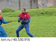 Festival of medieval reconstruction "Russian fortress", Fencing on swords in medieval costumes (2015 год). Редакционное фото, фотограф Анна Кривицкая / Фотобанк Лори