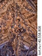 Czech Republic. Skulls and bones in the ossuary in Kutna Hora. Close up detailed view of Sedlec Ossuary, Church of Bones in Kutna Hora, decorated with real human skeleton bones. (2016 год). Редакционное фото, фотограф Анна Кривицкая / Фотобанк Лори
