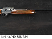 Smoothbore hunting gun on black background close up. Стоковое фото, фотограф Сергей Толмачёв / Фотобанк Лори