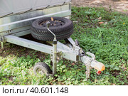 Tow hitch drawbar with spare wheel. Device for coupling a car and a trailer. Стоковое фото, фотограф Коханова Наталья / Фотобанк Лори