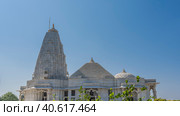 Beautiful white marble temple Birla Mandir- Lakshmi Narayana. Against the blue sky there are three domes of various shapes: oval, pyramidal, hemispherical. Columns, carved arches are visible. India. (2022 год). Стоковое фото, фотограф Вера Ивановна Кубарева / Фотобанк Лори