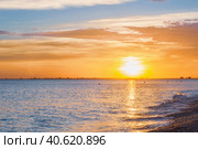 Beautiful summer sunset with clouds over the sea. Стоковое фото, фотограф Виктория Подгорная / Фотобанк Лори