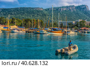 Turkey, Kemer, 11,08,2017 Boats and yachts in the Bay of Kemer. Turkey.  Marina bay on the mountain background. Редакционное фото, фотограф Анна Кривицкая / Фотобанк Лори