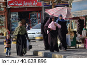 Egypt, Hurghada, 17,01,2009 A woman in a burqa in the streets of Egypt. Редакционное фото, фотограф Анна Кривицкая / Фотобанк Лори
