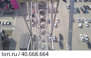 The design of the damn wheel on top in the amusement park. Стоковое видео, видеограф Variyy / Фотобанк Лори