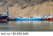 Port of Vestmannaeyjar with moored cargo anf fishing ships (2017 год). Редакционное фото, фотограф EugeneSergeev / Фотобанк Лори