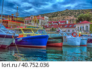 View of Balaklava bay with yachts on embankment of Balaklava in Sevastopol city. Yachts and boats moored to the shore of Balaklava. Crimea (2021 год). Редакционное фото, фотограф Анна Кривицкая / Фотобанк Лори