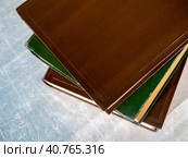 Old books are stacked on the table. Books are shifted relative to each other. View from above. Close-up. The concept of education, scientific work. Стоковое фото, фотограф Бузмакова Светлана / Фотобанк Лори