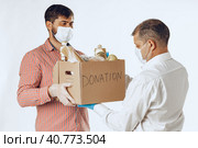 Donation box of food for people suffering from coronavirus pandemia. Стоковое фото, фотограф Сергей Толмачёв / Фотобанк Лори