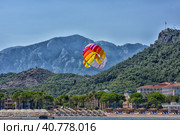 Turkey, Kemer 17,07,2015 Parasailing near the sea. Редакционное фото, фотограф Анна Кривицкая / Фотобанк Лори