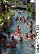 Pammukale, Turkey - July, 19, 2015: People in antique Cleopatra's pool with thermal water in ancient city Hierapolis, near modern Turkey city Denizli. Редакционное фото, фотограф Анна Кривицкая / Фотобанк Лори