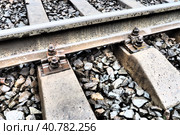 Railways. Metal steel rails and wooden sleepers. Rivets and fasteners on the railroad. Stony backfill of railway tracks. Station Nyrki, Karelia. Стоковое фото, фотограф Юлия Петровская / Фотобанк Лори