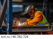 A man-welder fastens iron girders with a welding machine. Construction of the station. Generative AI. Стоковое AI-изображение, AI-художник Юрий Поздников / Фотобанк Лори