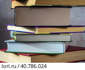 Books in a stack are shifted at an angle to each other. Close-up. Background for universities, libraries, science. Стоковое фото, фотограф Бузмакова Светлана / Фотобанк Лори