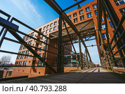 Famous landmark old Speicherstadt in Hamburg, build with red bricks. Bridge in low angle view. Стоковое фото, фотограф Igor Tichonow / Фотобанк Лори