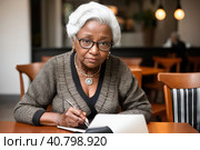 Mature afroamerican women at coffee shop. Portrait of confident mature professional woman sitting in cafe, using laptop computer for work, smiling happily indoors. Generative AI. Стоковое AI-изображение, AI-художник Sergey Grishin / Фотобанк Лори
