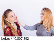 Two young woman fighting, a slapping in the face. Стоковое фото, фотограф Сергей Сергеев / Фотобанк Лори