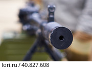 The muzzle of a weapon close-up. The barrel of a machine gun at an arms exhibition. The concept of aggression and the threat of death. Selective focus. Стоковое фото, фотограф Алексей Игнатов / Фотобанк Лори