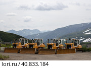 Bulldozers in a mountain valley. Construction and industry in the mountains. Kamchatka Territory, Far East of Russia. Редакционное фото, фотограф Андрей Степанов / Фотобанк Лори