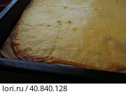 Razlevusha or razlevak, delicious Balkan pie or flatbread baked in the oven on a baking sheet of eggs, flour, cheese, sour cream or yogurt. Bosnian - Herceg - Serbian - Macedonian - Croatian recipe. Стоковое фото, фотограф Юлия Петровская / Фотобанк Лори