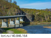 Automobile bridge over the Kondoma river in the village of Mundybash, Gornaya Shoria. Стоковое фото, фотограф Ольга Остроухова / Фотобанк Лори