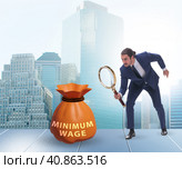 Concept of minimum wage with businessman. Стоковое фото, фотограф Elnur / Фотобанк Лори