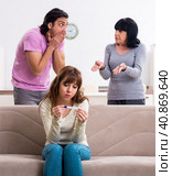 Young family and mother-in-law in family issues concept. Стоковое фото, фотограф Elnur / Фотобанк Лори