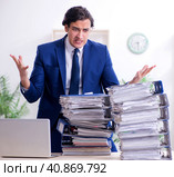 Young male employee unhappy with excessive work. Стоковое фото, фотограф Elnur / Фотобанк Лори