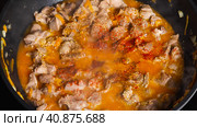 Close-up of Chicken Gizzard stewed in a wok with vegetables sprinkled with paprika. Top view. Asian-style cooking. Стоковое фото, фотограф Воловодов Владимир / Фотобанк Лори