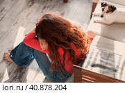 Sad depressed young adult woman crying alone at home, upset. Стоковое фото, фотограф Гладских Татьяна / Фотобанк Лори