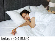 A young attractive girl is sleeping in bed. Стоковое фото, фотограф Виктория Тельминова / Фотобанк Лори